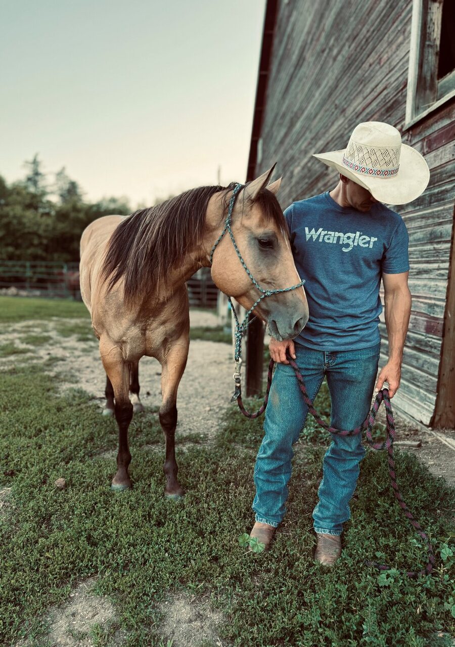 Jon Anderson with a horse at the barn